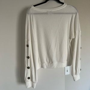 White cropped sweater with button details